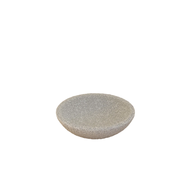 A small round stone dish with a speckled beige and gray texture, shown on a plain white background.
