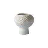 A small ceramic vase with a textured, honeycomb-like patterned body and a flared pedestal base, shown on a plain white background.