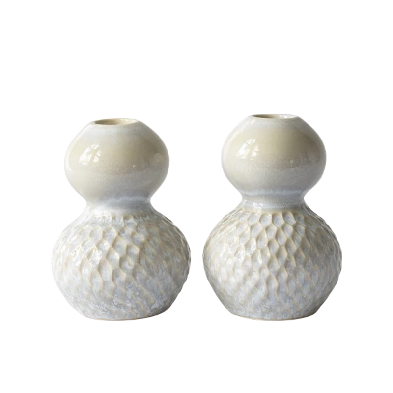 Two small ceramic bud vases with a glossy cream upper bulb and a textured, dimpled lower bulb, shown on a plain white background.